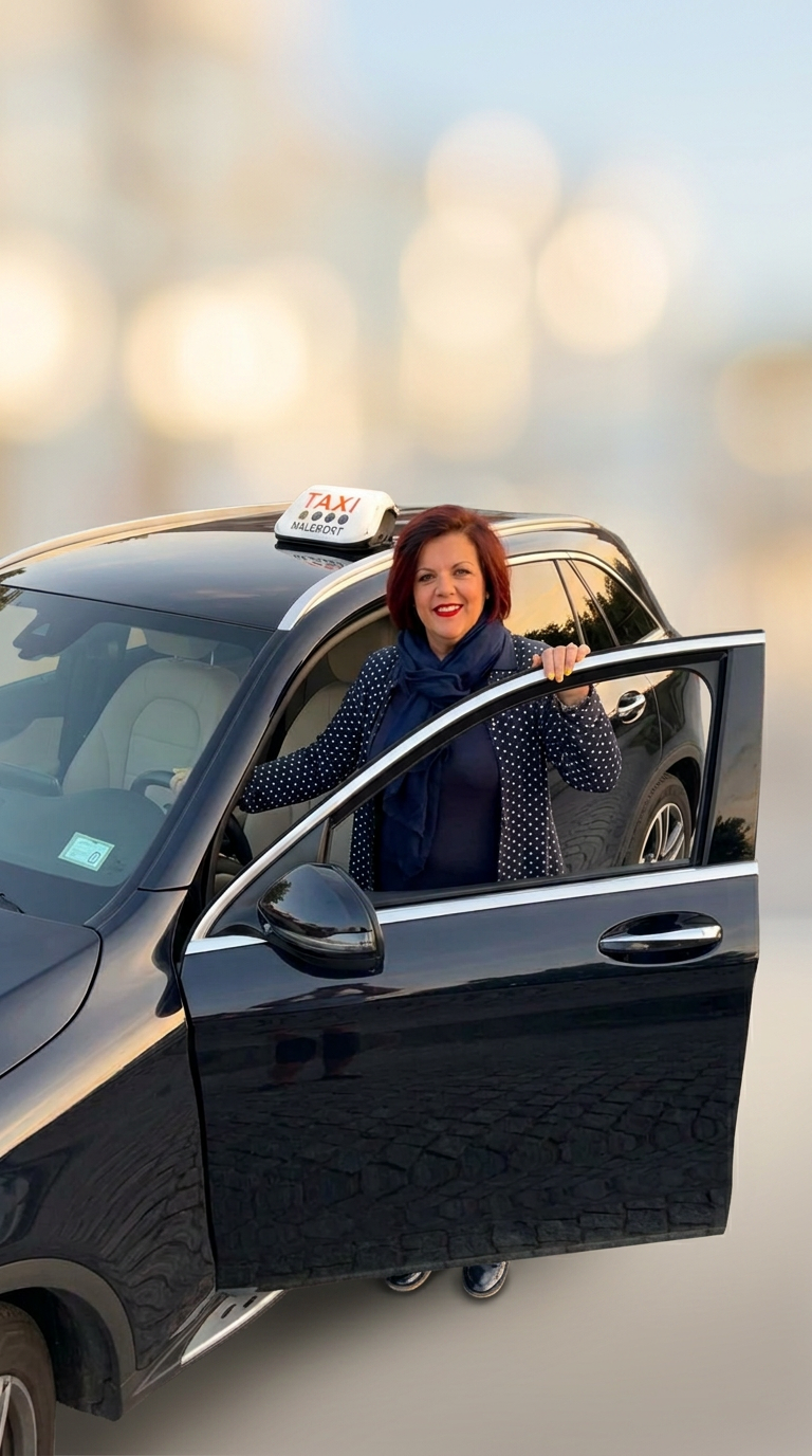 Sophie, artisan taxi à Malemort, devant son Mercedes GLC